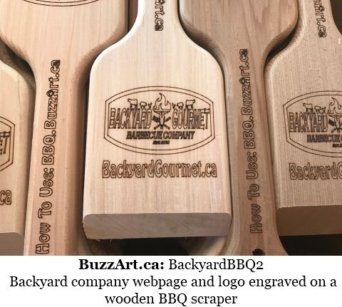 Backyard company webpage and logo engraved on a wooden BBQ scraper